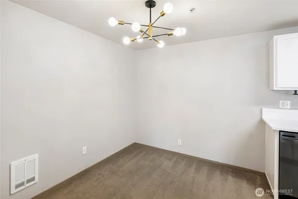 a view of a room with a sink cabinets and a window