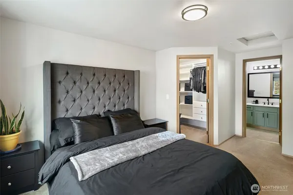 a bedroom with a bed and dresser