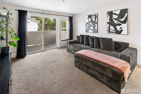 a living room with furniture and a large window