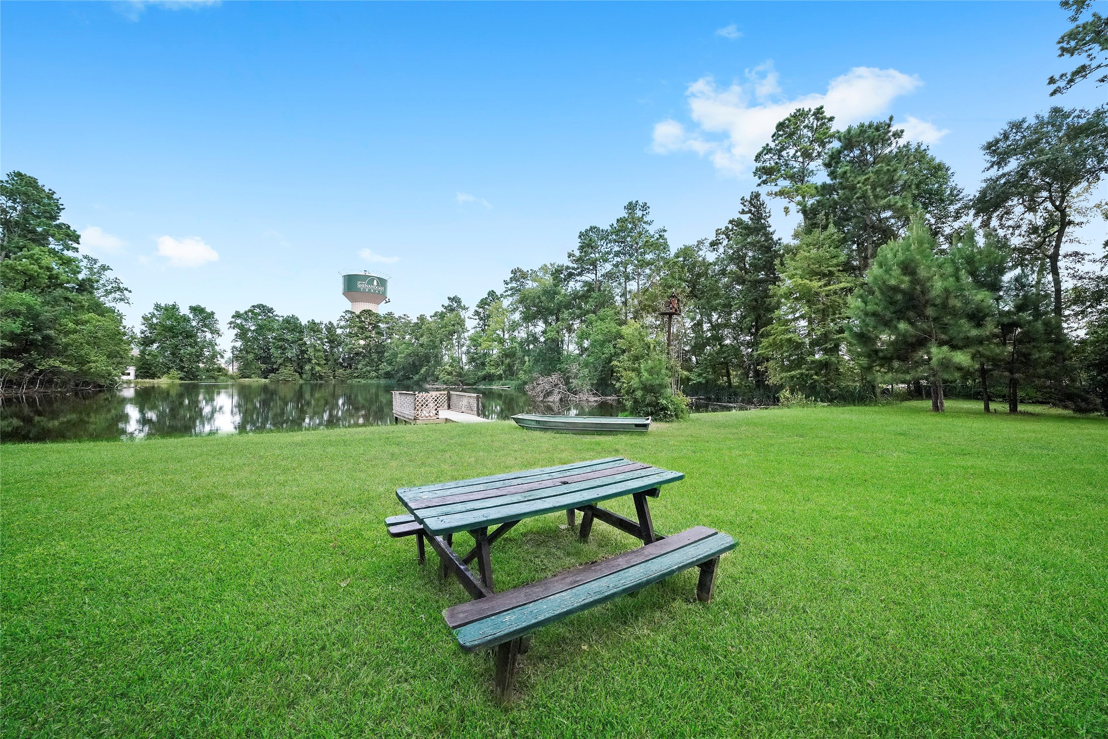 18121 Atkinson Lane Conroe, TX 77384 - Photo 11 of 29 a park view with a bench in the garden