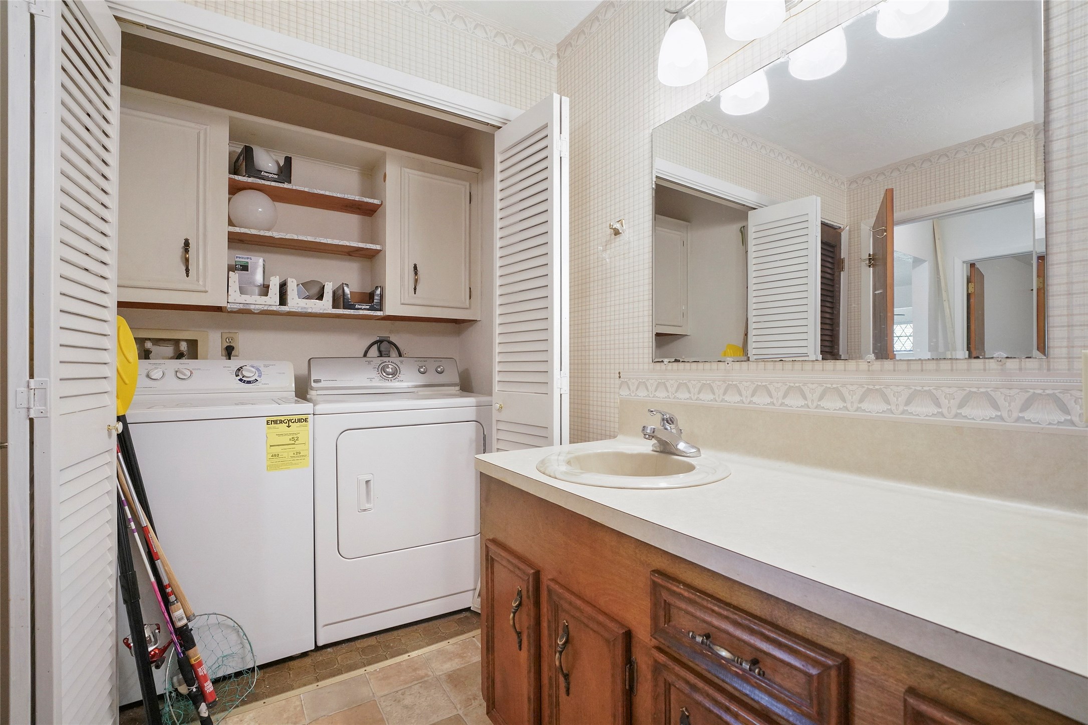 18121 Atkinson Lane Conroe, TX 77384 - Photo 18 of 29 a utility room with cabinets washer and dryer