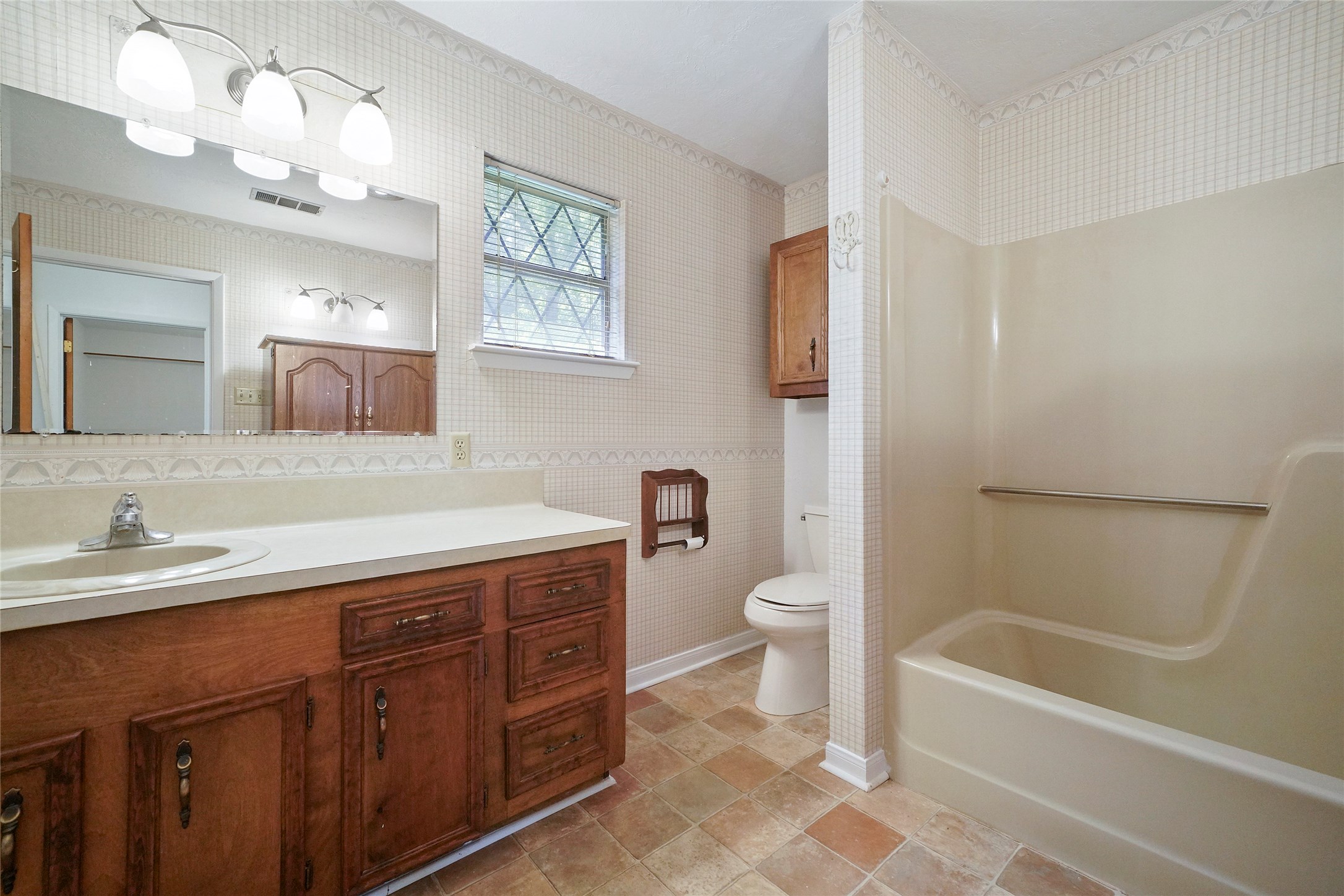 18121 Atkinson Lane Conroe, TX 77384 - Photo 21 of 29 a bathroom with a sink a toilet and shower