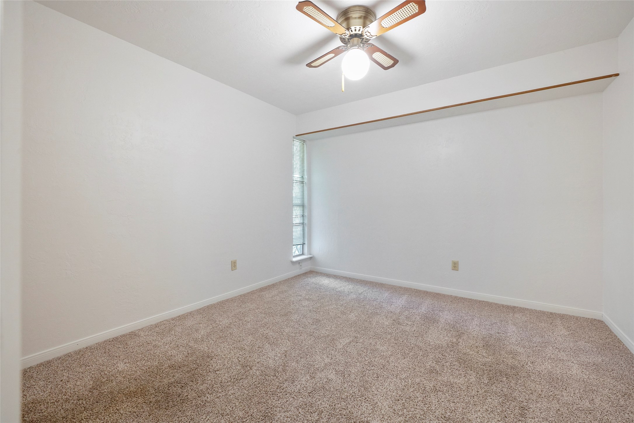 18121 Atkinson Lane Conroe, TX 77384 - Photo 23 of 29 an empty room with chandelier fan