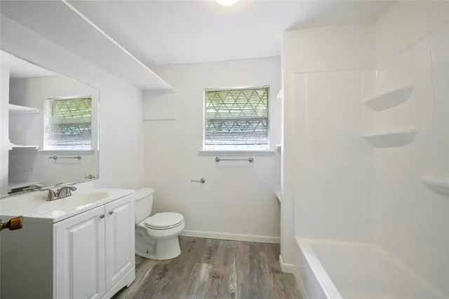 a bathroom with a sink a toilet and a bathtub