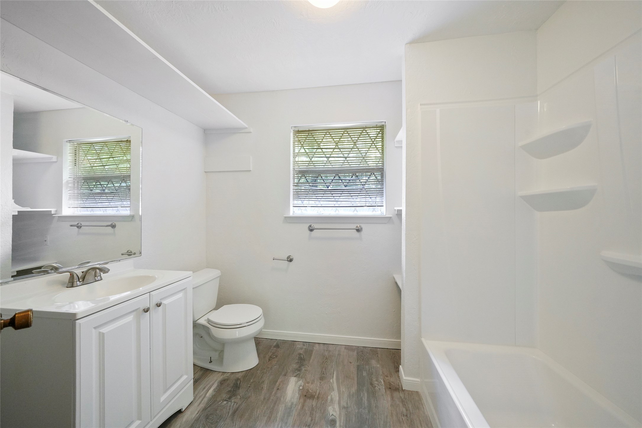 18121 Atkinson Lane Conroe, TX 77384 - Photo 24 of 29 a bathroom with a sink a toilet and a bathtub