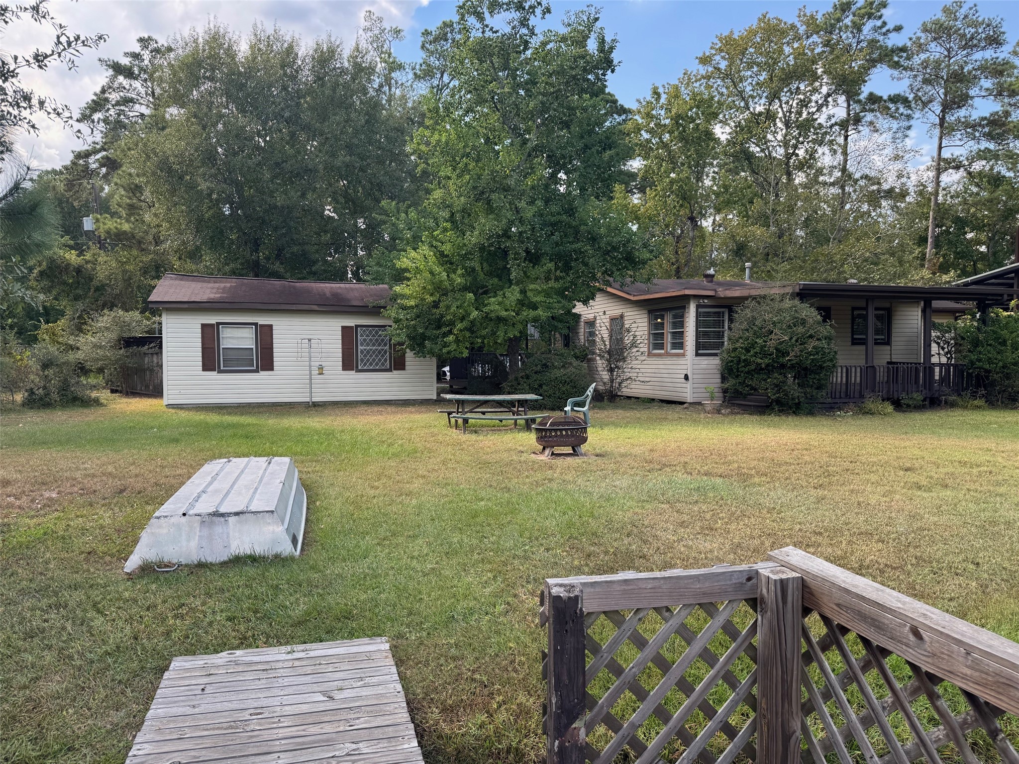 18121 Atkinson Lane Conroe, TX 77384 - Photo 27 of 29 a front view of house with yard and trees in the background
