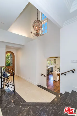 a kitchen with a stove and wooden floor