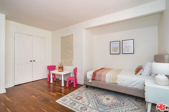 a living room with furniture a fireplace and a chandelier