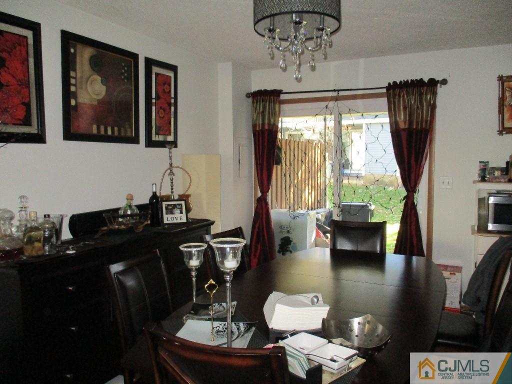 4604 Hana Road Edison, NJ 08817 - Photo 3 of 11 a living room with furniture and a large window