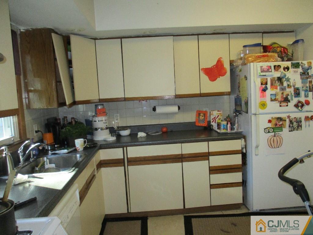 4604 Hana Road Edison, NJ 08817 - Photo 4 of 11 a kitchen with a sink and cabinets