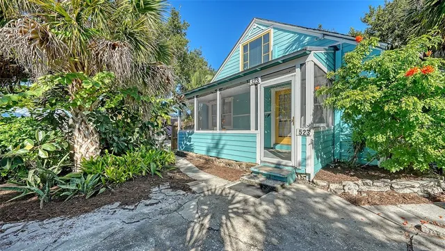 a view of a room with furniture and windows
