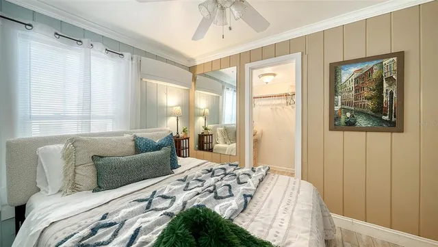 a spacious bedroom with a bed and a window