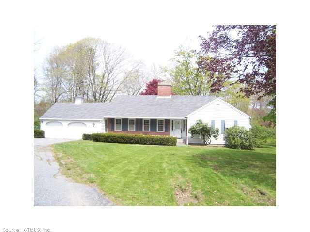 95 Putnam Road Pomfret, CT 06259 - Photo 1 of 1 a backyard of a house with table and chairs