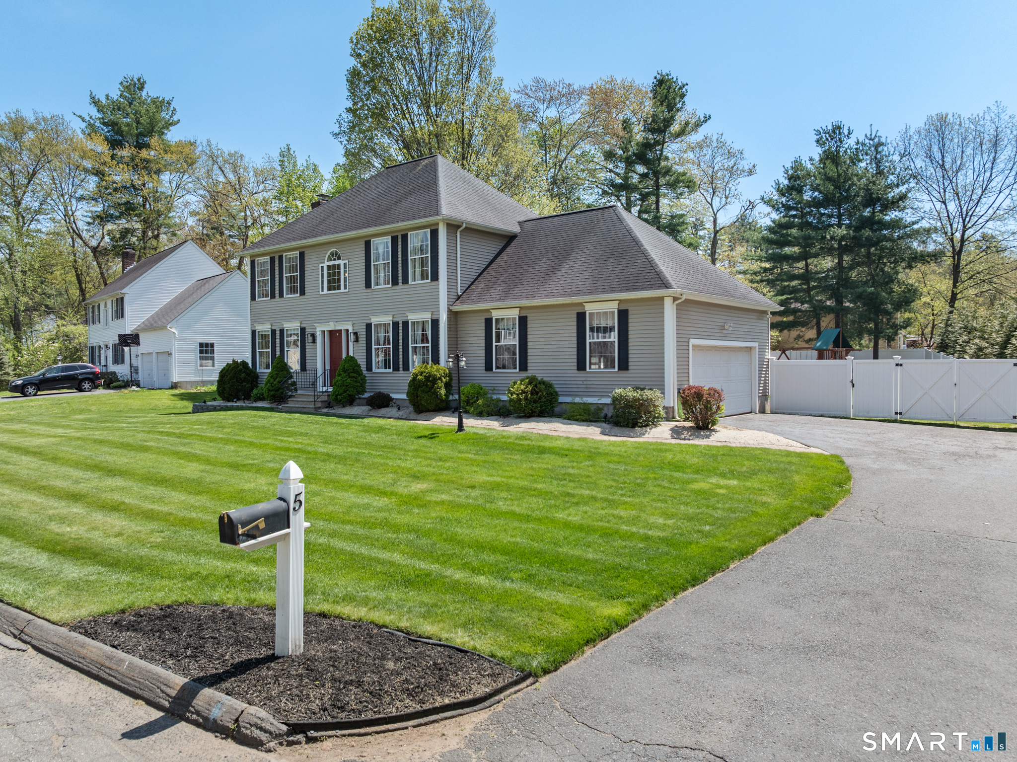 5 Ice Pond Road Granby, CT 06035 - Photo 2 of 40 a front view of a house with a yard