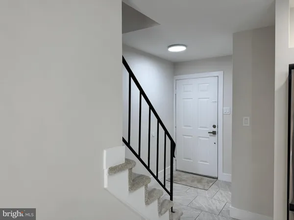 a view of entryway with stairs