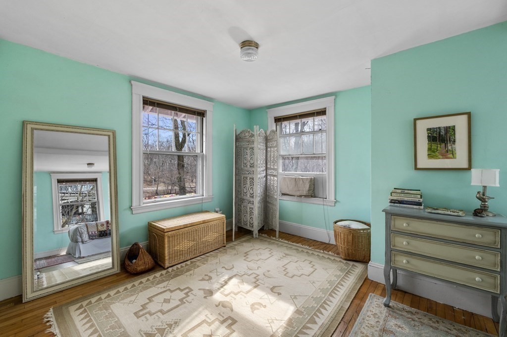 10 High Rock Way Boston, MA 02135 - Photo 17 of 26 a bedroom with furniture and a window