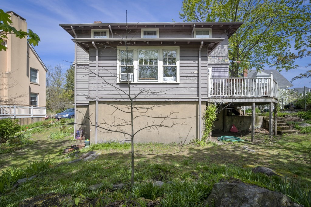 10 High Rock Way Boston, MA 02135 - Photo 20 of 26 a view of a house with a yard and sitting area