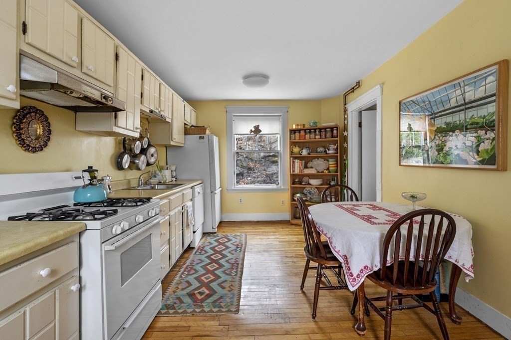 10 High Rock Way Boston, MA 02135 - Photo 10 of 26 a kitchen that has a table and chairs in it