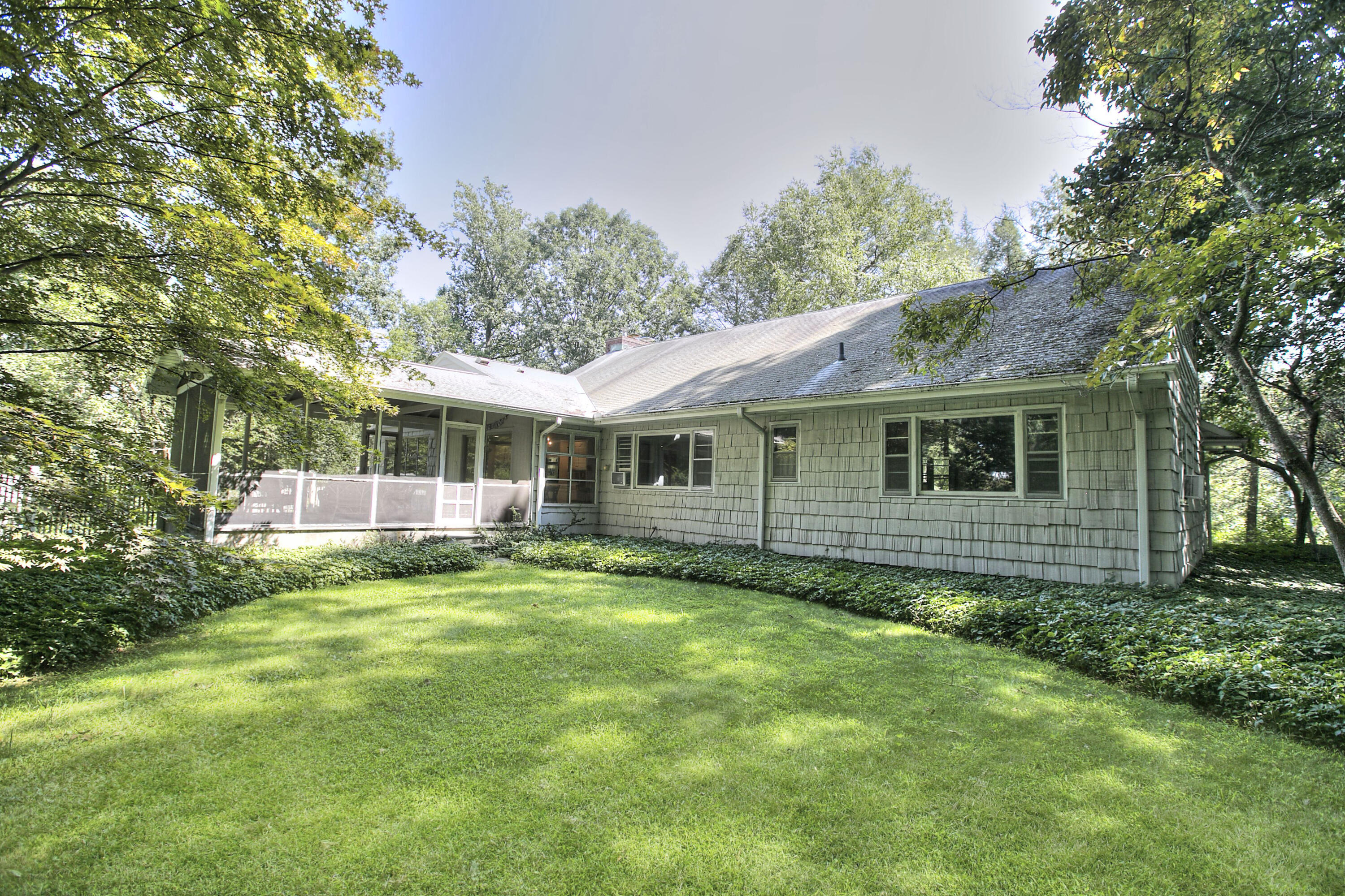 25 Hillcrest Road New Canaan, CT 06840 - Photo 2 of 19 a view of a house with a yard and sitting area