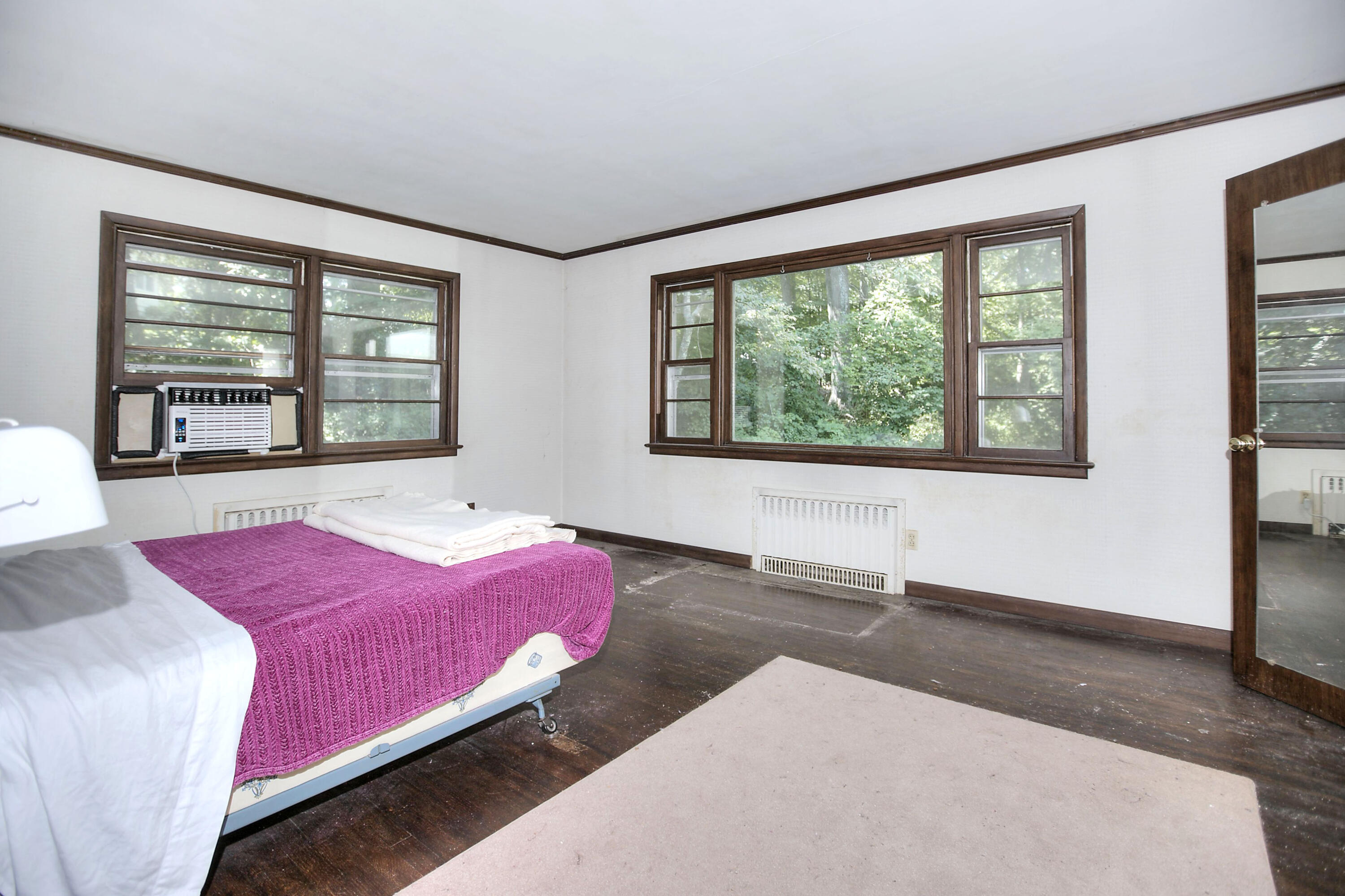25 Hillcrest Road New Canaan, CT 06840 - Photo 14 of 19 a bedroom with a large bed and a large window