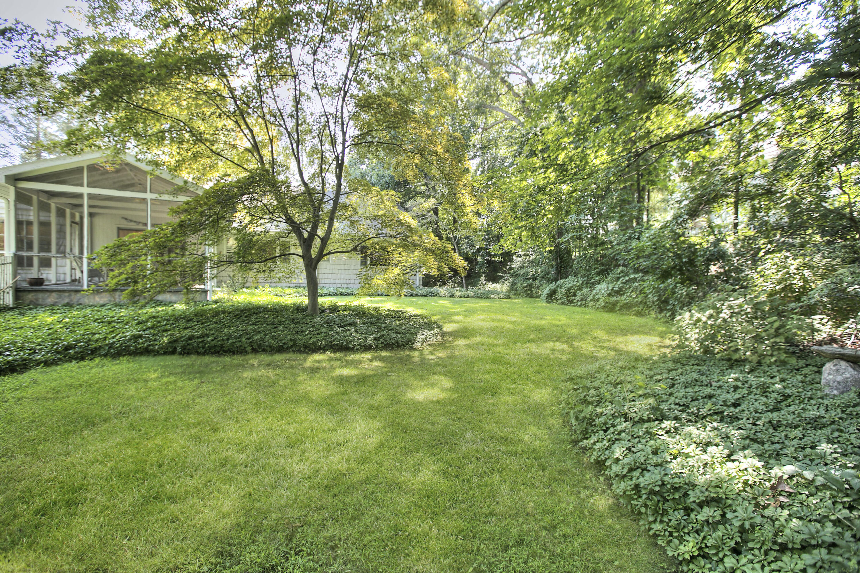 25 Hillcrest Road New Canaan, CT 06840 - Photo 17 of 19 a view of green field with trees in the background