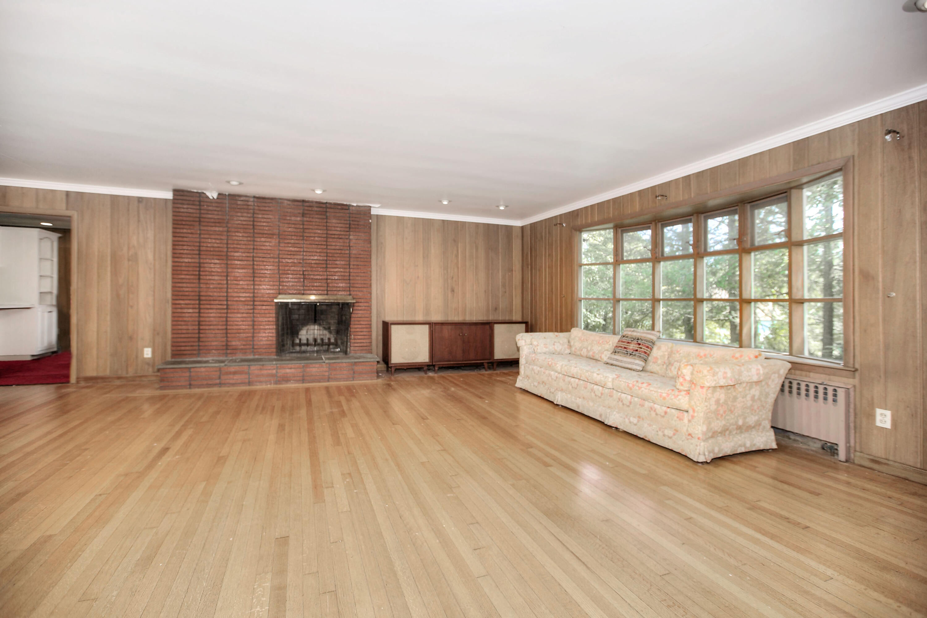 25 Hillcrest Road New Canaan, CT 06840 - Photo 9 of 19 a spacious bedroom with a large bed and a large window
