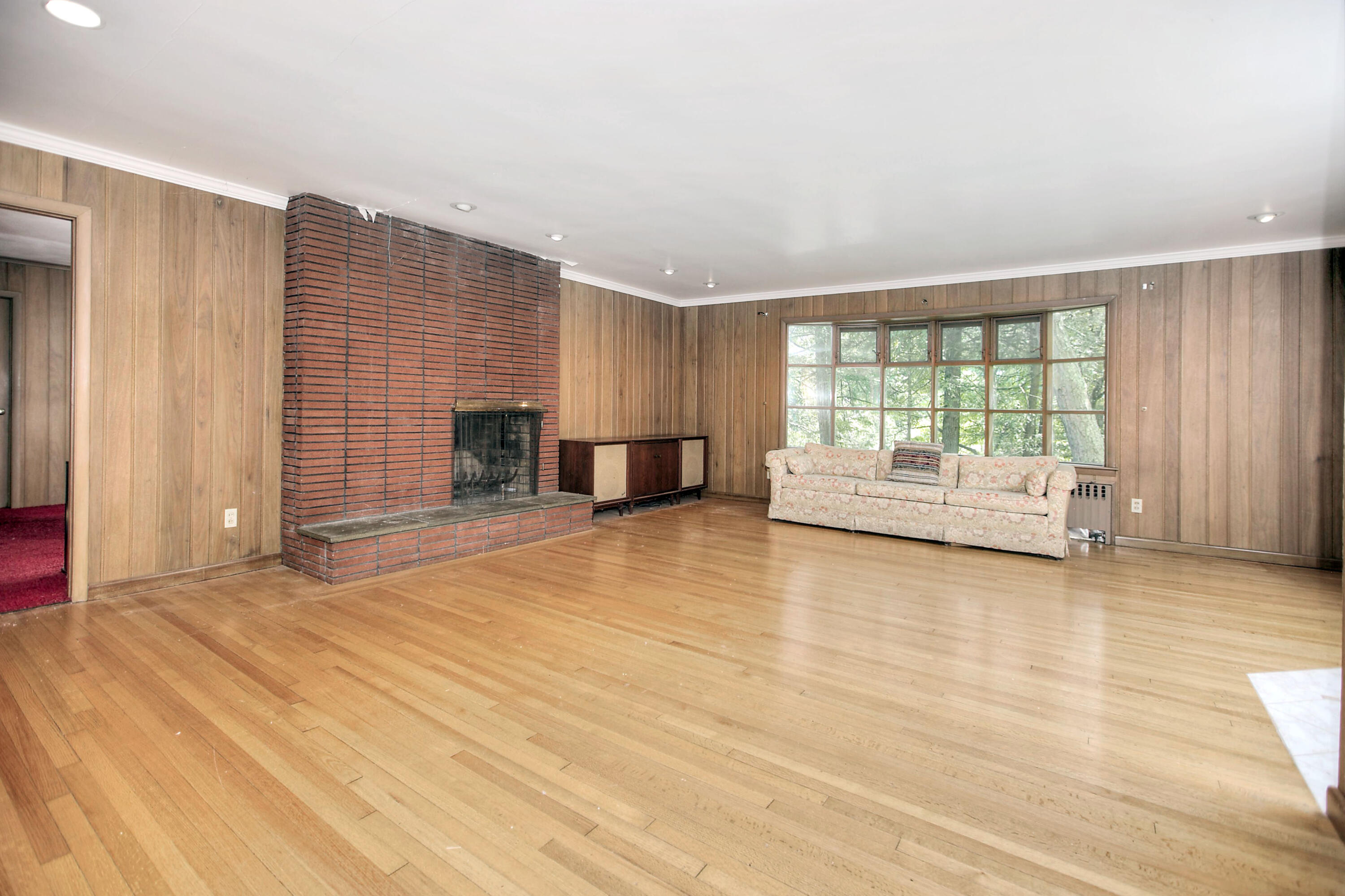 25 Hillcrest Road New Canaan, CT 06840 - Photo 10 of 19 a view of livingroom with furniture and floor to ceiling window