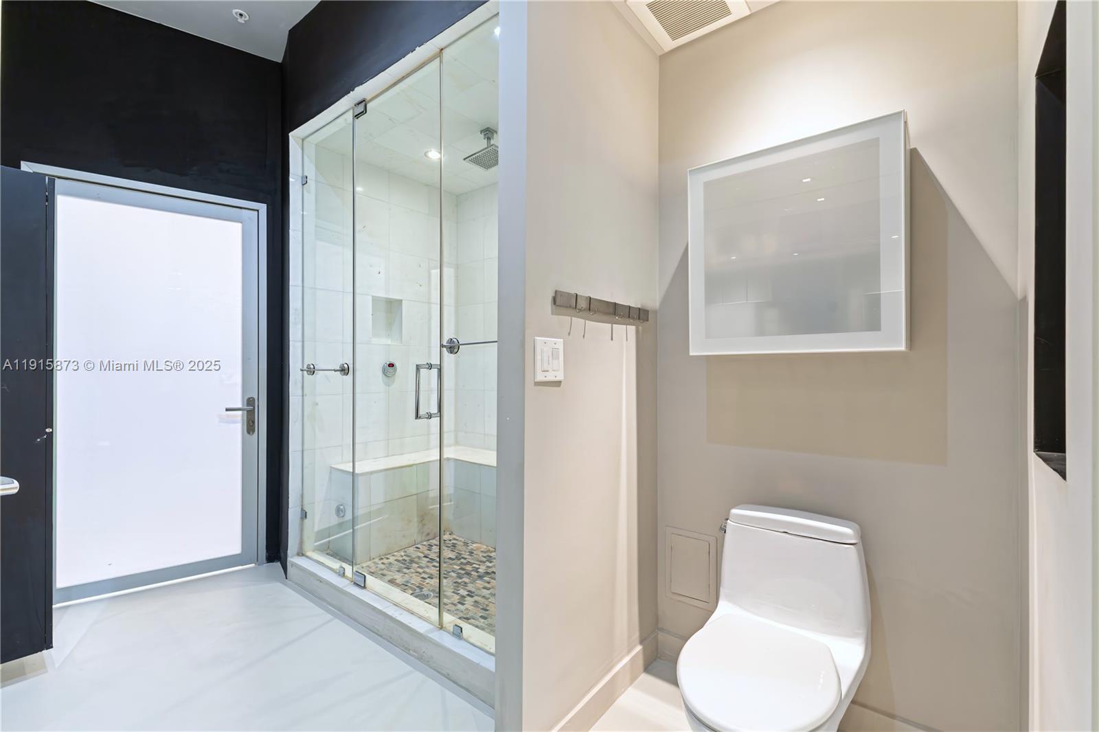 2001 Meridian Avenue, Unit 515 Miami Beach, FL 33139 - Photo 16 of 26 a bathroom with a toilet sink and shower