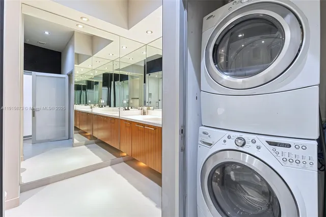 a view of a hallway with washer and dryer