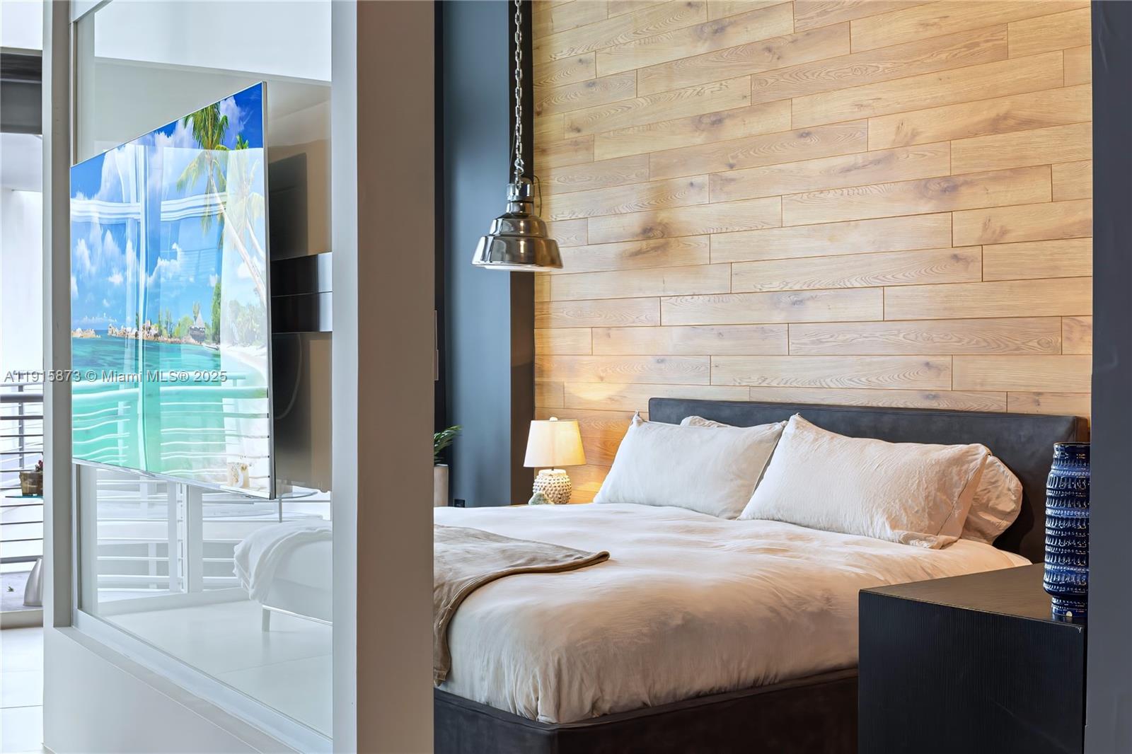 2001 Meridian Avenue, Unit 515 Miami Beach, FL 33139 - Photo 10 of 26 a bedroom with a bed and a window