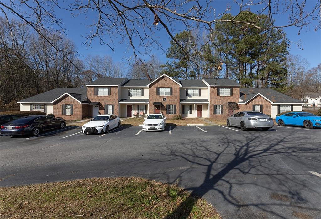 5058 Jonesboro Road, Unit E37 Union City, GA 30291 - Photo 1 of 4 a car parked in front of a house