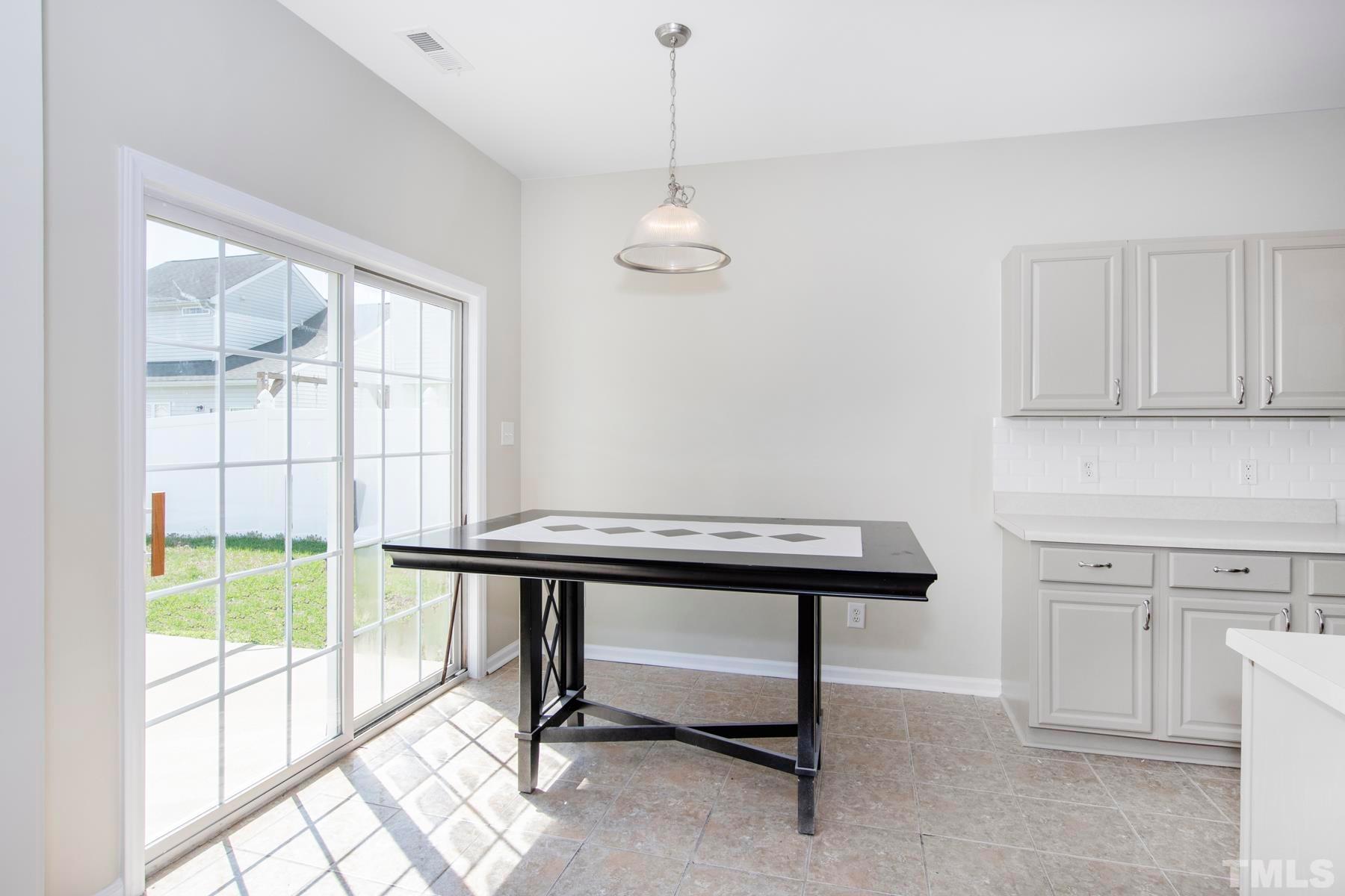 7814 Braefield Drive Raleigh, NC 27616 - Photo 9 of 29 a view of a room with gym equipment