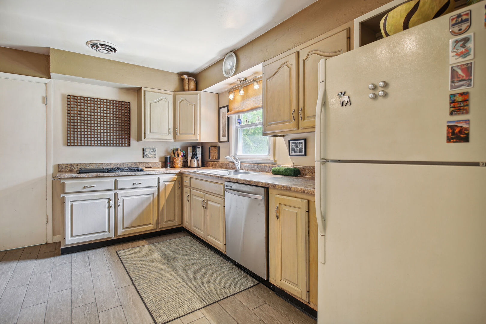 5 Normandy Place Champaign, IL 61821 - Photo 11 of 25 a kitchen with white cabinets and white appliances