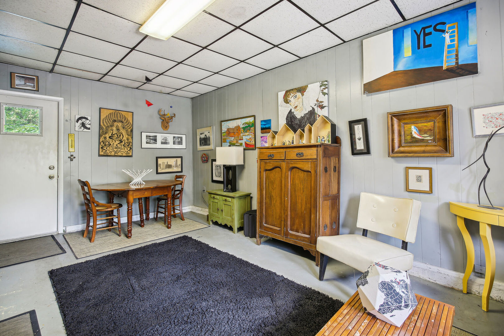5 Normandy Place Champaign, IL 61821 - Photo 12 of 25 a living room with furniture and paintings on the wall