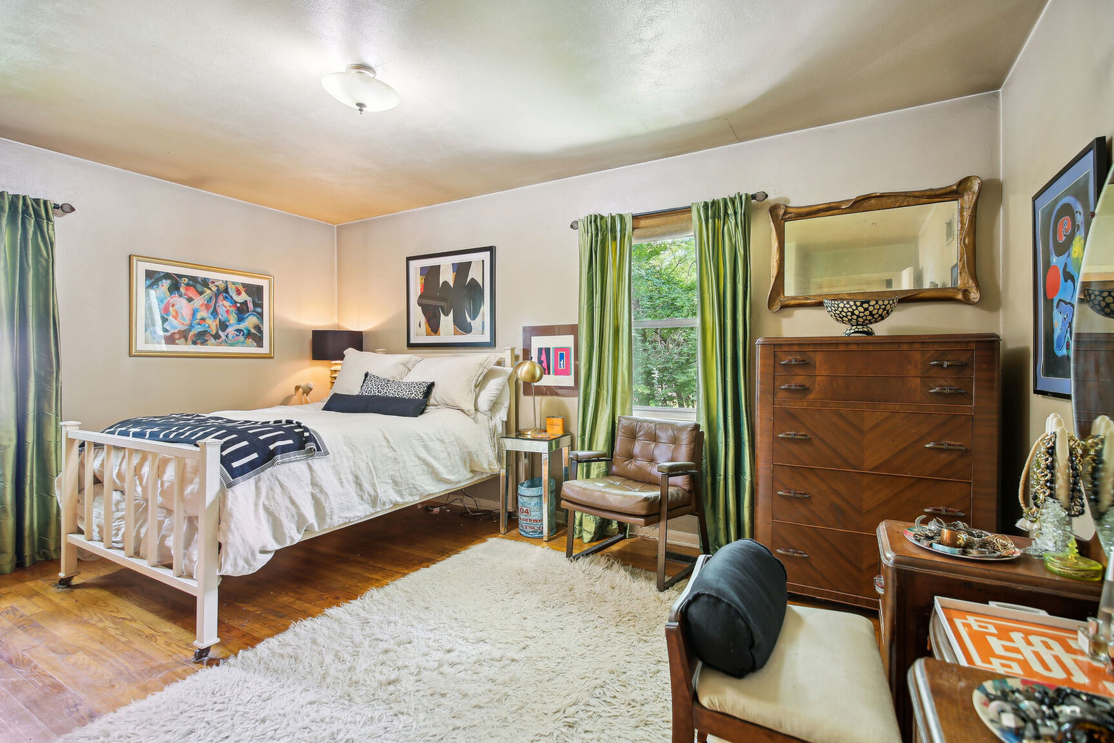 5 Normandy Place Champaign, IL 61821 - Photo 14 of 25 a bedroom with a bed and a flat screen tv