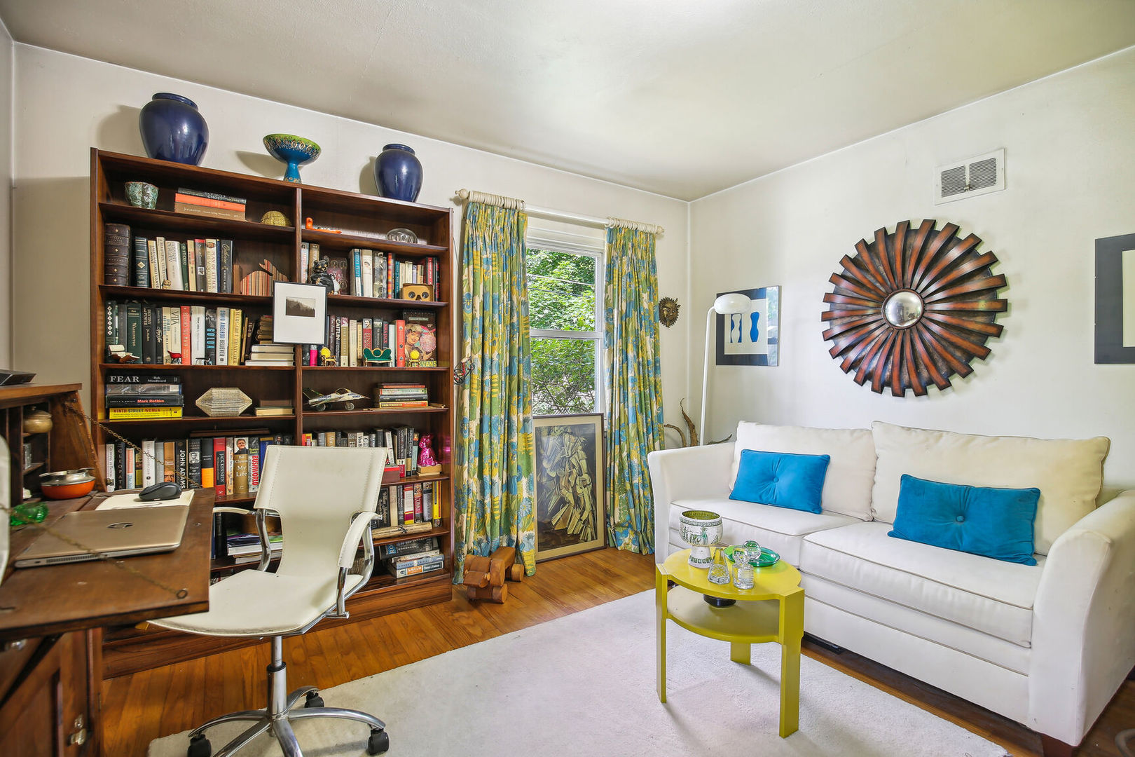 5 Normandy Place Champaign, IL 61821 - Photo 20 of 25 a living room with furniture a bookshelf and a window
