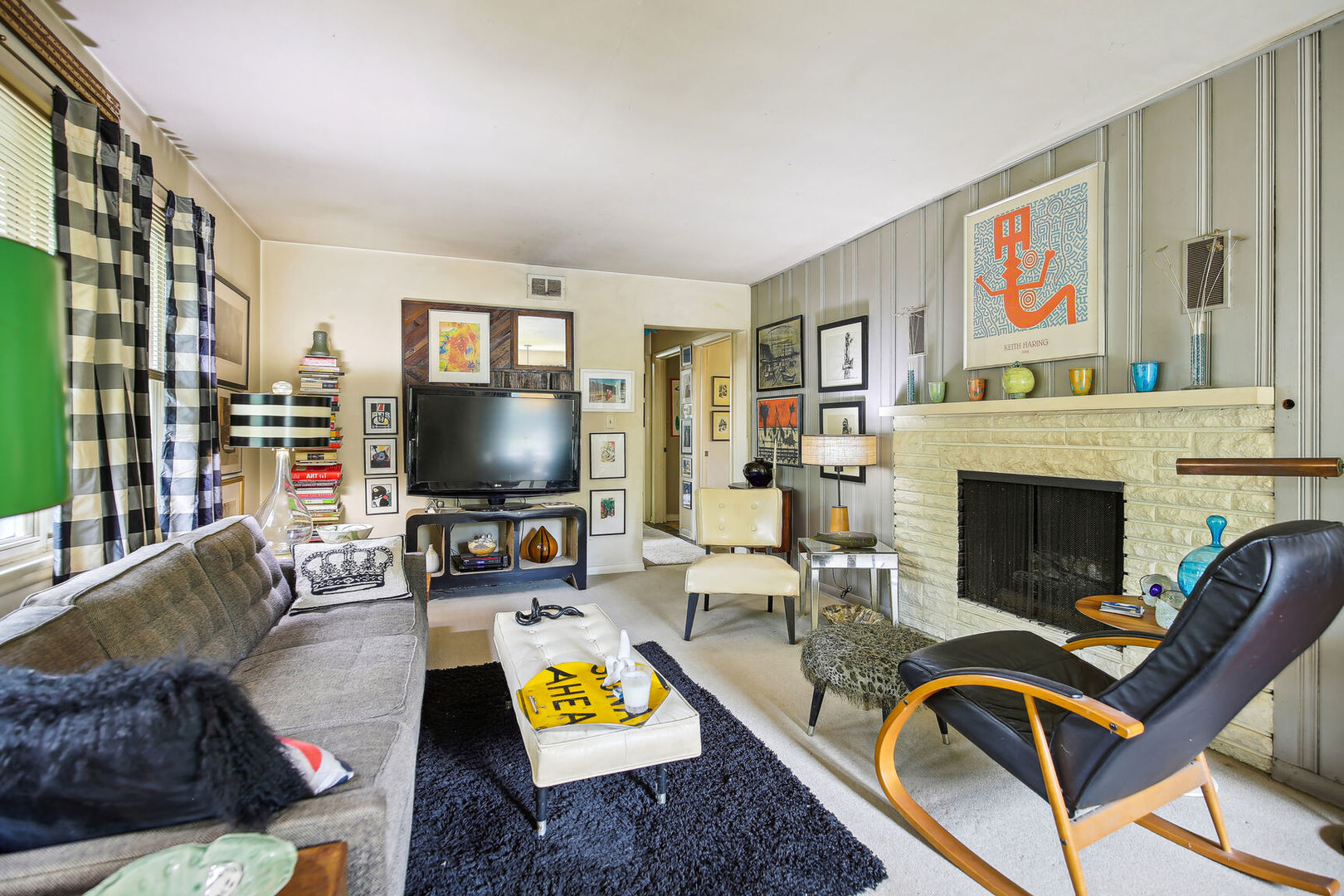 5 Normandy Place Champaign, IL 61821 - Photo 4 of 25 a living room with furniture a flat screen tv and a fireplace