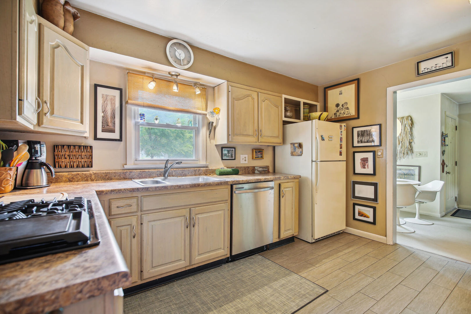 5 Normandy Place Champaign, IL 61821 - Photo 9 of 25 a kitchen with stainless steel appliances granite countertop a refrigerator and a stove