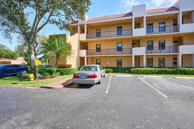 a parked cars parked in front of a building