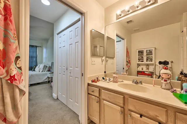a en suite spacious bathroom with shower sink and mirror