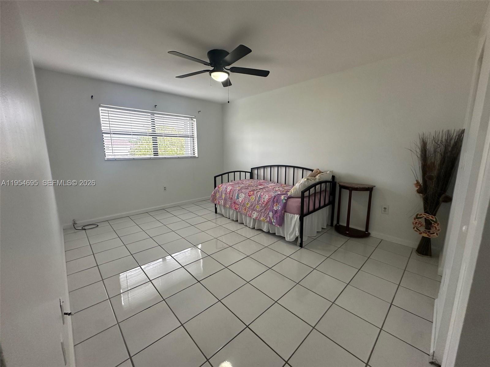 13671 Southwest 62nd Street, Unit 2011 Miami, FL 33183 - Photo 13 of 24 a view of an empty room and window