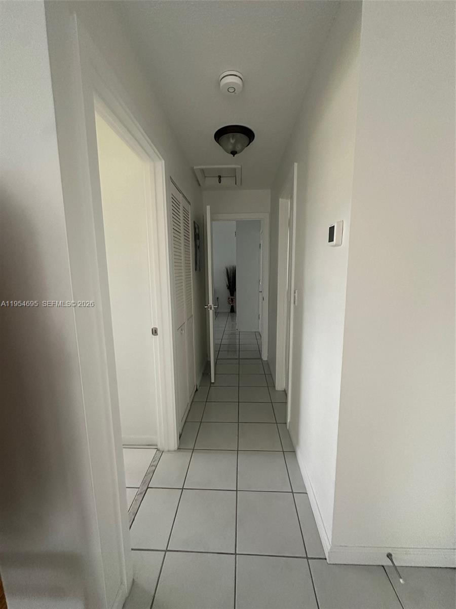 13671 Southwest 62nd Street, Unit 2011 Miami, FL 33183 - Photo 19 of 24 a view of a hallway