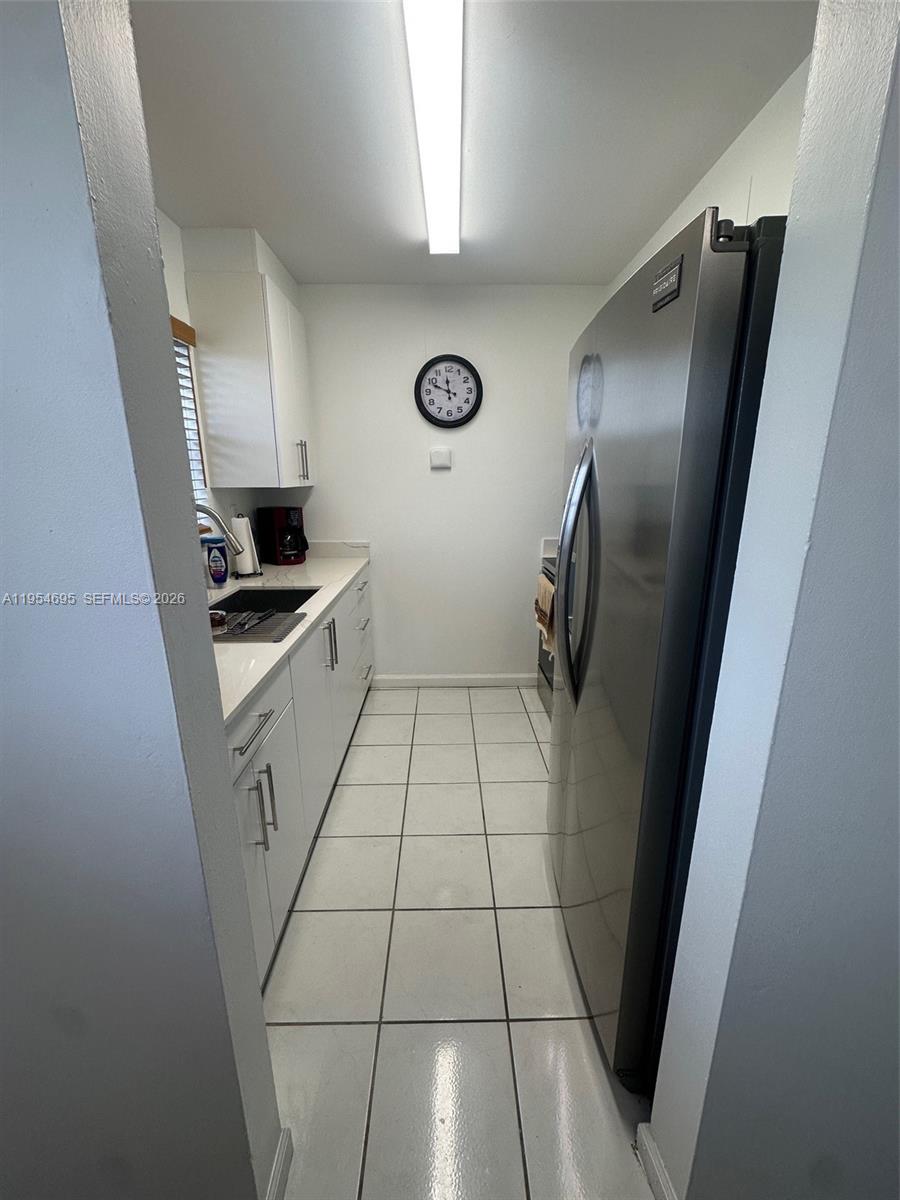 13671 Southwest 62nd Street, Unit 2011 Miami, FL 33183 - Photo 4 of 24 a view of empty room with wooden floor
