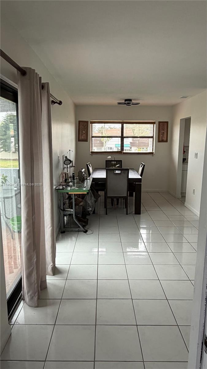 13671 Southwest 62nd Street, Unit 2011 Miami, FL 33183 - Photo 4 of 20 a kitchen with granite countertop a sink and a counter top space