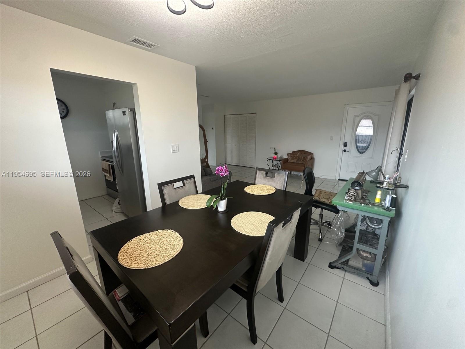 13671 Southwest 62nd Street, Unit 2011 Miami, FL 33183 - Photo 7 of 24 a view of a dining room with furniture