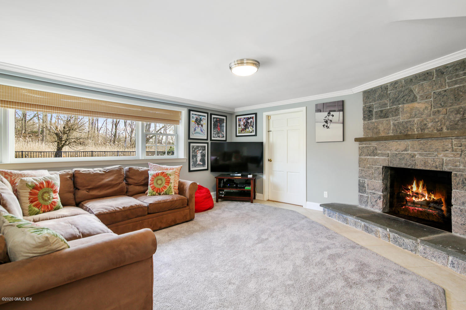 7 Highgate Road Riverside, CT 06878 - Photo 18 of 34 a living room with furniture and a fireplace