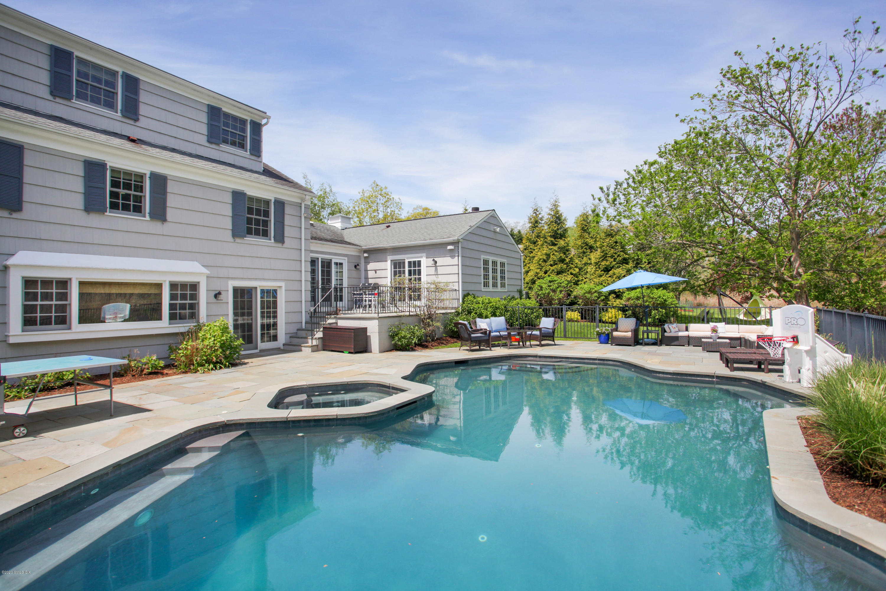 7 Highgate Road Riverside, CT 06878 - Photo 19 of 34 a view of a patio with swimming pool table and chairs