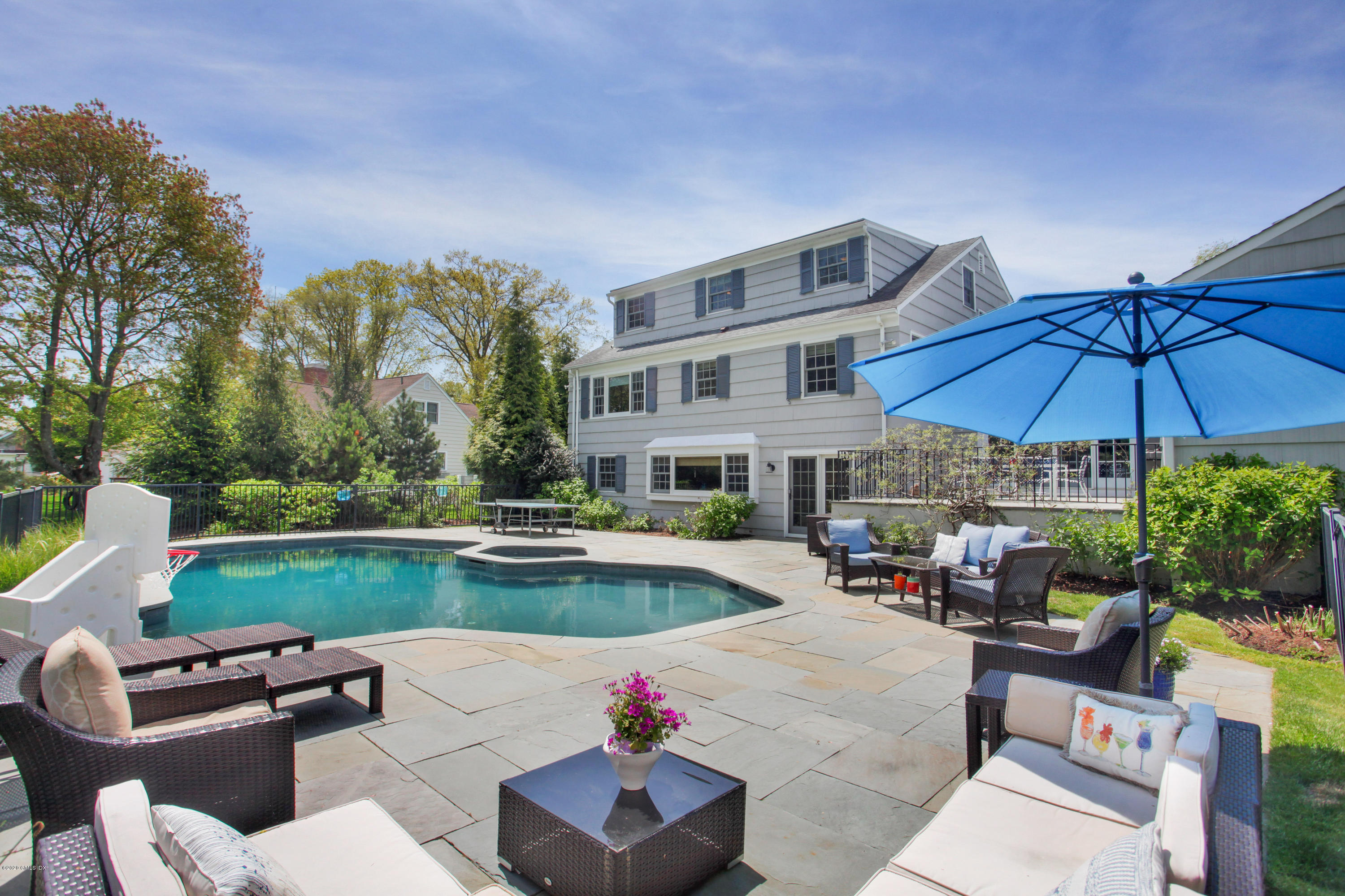 7 Highgate Road Riverside, CT 06878 - Photo 20 of 34 a view of a swimming pool with lounge chairs in patio