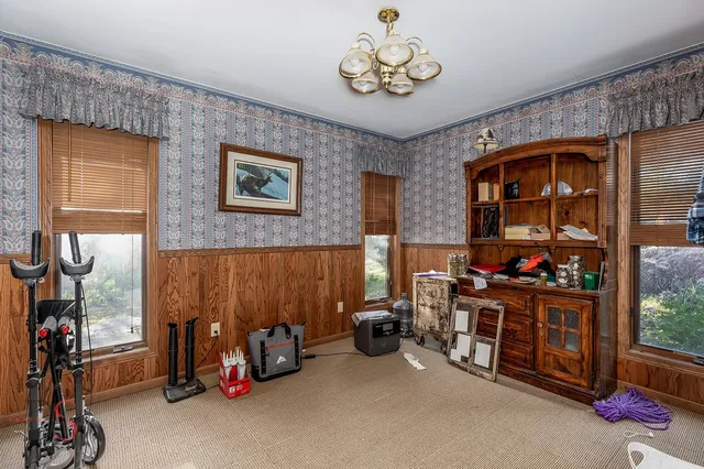 a bedroom with furniture and a chandelier