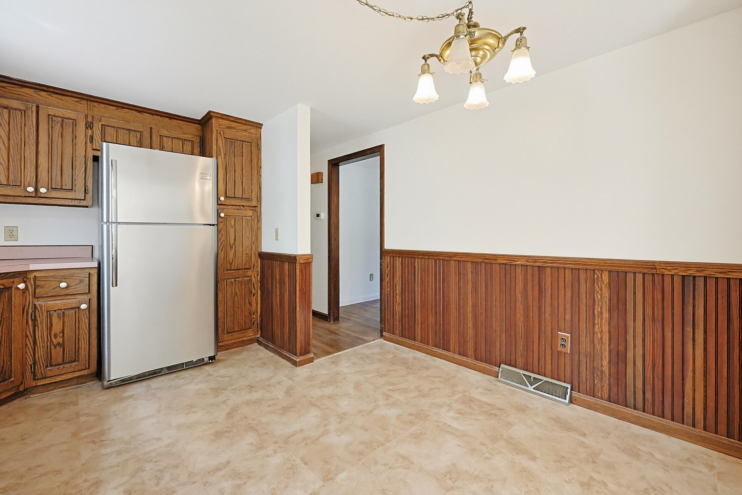 556 Cotuit Road Mashpee, MA 02649 - Photo 14 of 45 a view of an empty room with a kitchen